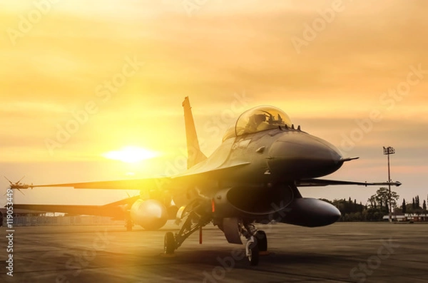 Obraz f16 falcon fighter jet zaparkowany na tle zachodu słońca