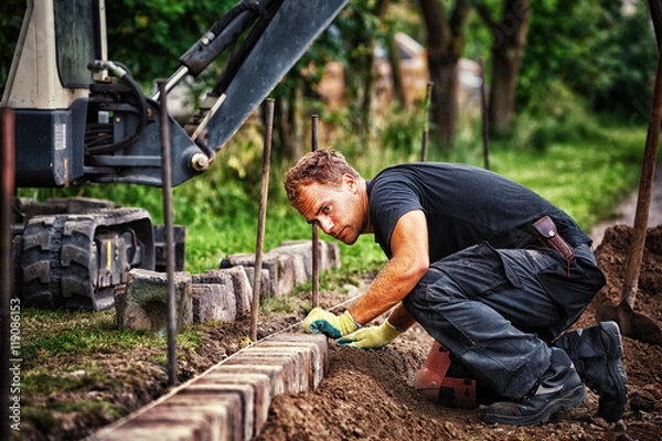 Fototapeta Preparing the Paving: Placing the Edging