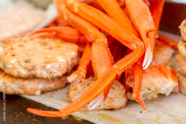 Obraz hamburgers and hotdogs cooking on grill outdoors