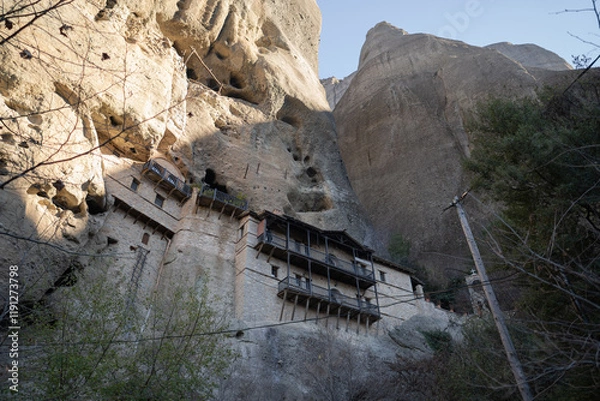 Fototapeta Monastery of St. Anthony carved into the cliffs of Meteora, Greece. A serene symbol of spirituality and ancient architecture