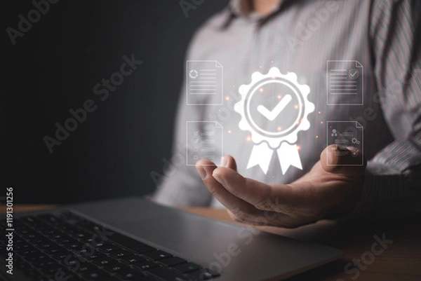 Fototapeta A person holds a glowing quality control badge hologram featuring a checkmark and surrounding digital document icons, symbolizing certification, standards, and reliable assurance in modern processes.