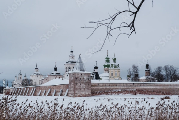 Fototapeta View of the Kirillo-Belozersky Monastery from the lake side through the trees. Vologda Region