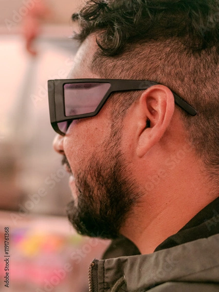 Fototapeta male person with beard and glasses with his face in profile 