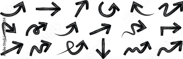 Fototapeta Brush drawn curved arrows. Hand drawn brush arrows in different directions. Vector direction curved and wavy brush arrow strokes vector. Curved grunge arrows