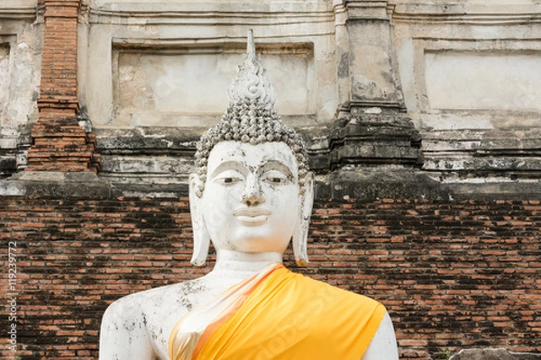 Obraz Close-up old Buddha image in yellow robe