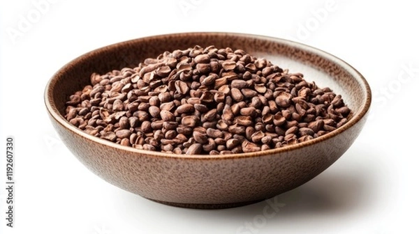 Fototapeta Cacao beans displayed in a rustic bowl showcasing their rich brown color and natural texture on a white background.