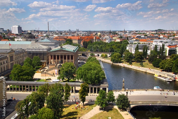 Obraz Berlin, Germany - July 9, 2024: View of central Berlin from the Berlin Cathedral, with Museum Island, the Spree River, and iconic city landmarks under a clear summer sky.