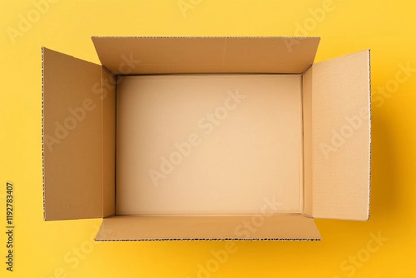 Fototapeta empty cardboard box viewed from above on yellow background