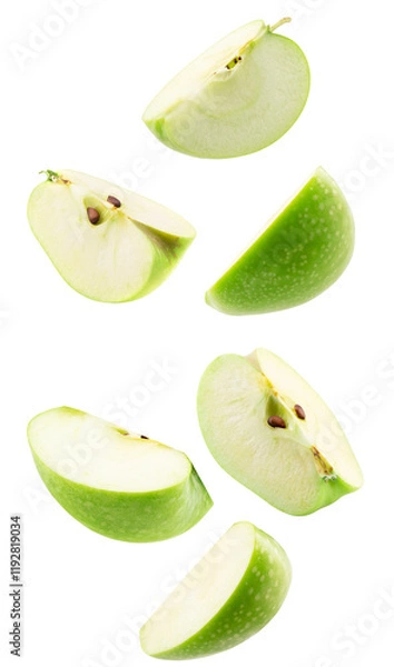 Fototapeta falling slices of green apple isolated on a white background