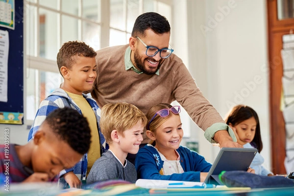 Fototapeta Primary multiethnic pupils working on digital tablet with teacher
