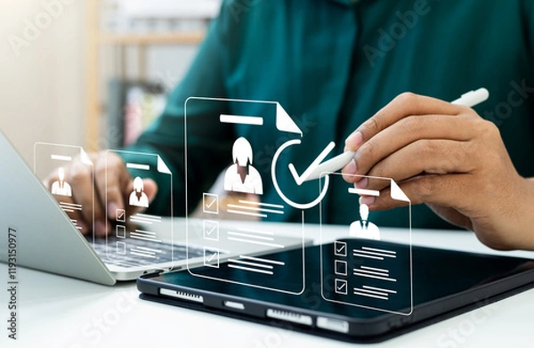 Obraz Human resource technology, HR recruitment and team management, Human resource manager reviewing online CVs to select perfect candidate for employment using digital technology and networking tools