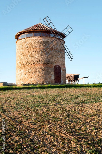 Fototapeta Manchego style windmill located in the town of Aguilar de Campos, Tierra de Campos, Spain. This mill is similar to those of Don Quixote but currently a rarity in the northern plateau of Spain.