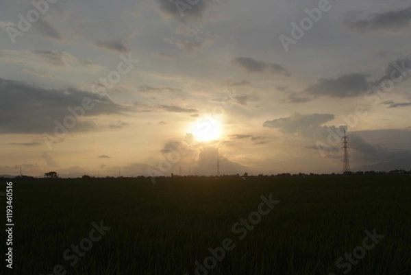 Fototapeta Beautiful sky with natural gradations. Thick clouds in the dusk sky on a winter night. Image of a cloudy sky in the afternoon. View of the night sky with golden light from the evening sun