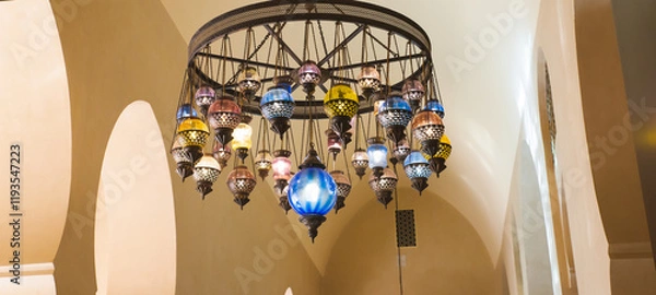 Fototapeta Hassan II Mosque, Morocco - March 26, 2024: Exquisite ceiling and chandeliers inside the mosque. Showcasing Moroccan artistic tradition and advanced architectural techniques.