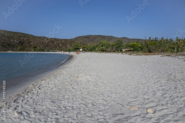 Fototapeta The beautiful white beach of Cala Pira in Castadias with its transparent and turquoise water