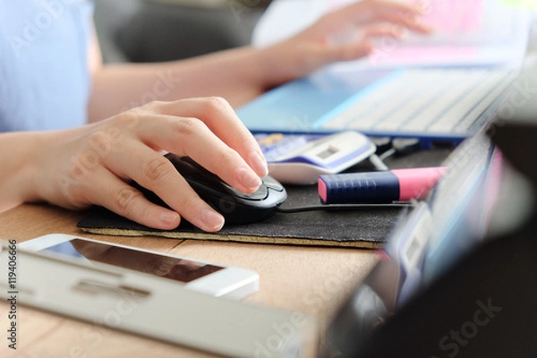 Fototapeta woman hand using a computer mouse, working time