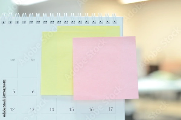 Fototapeta Colorful of paper notes on calendar at business office with copy space for text.