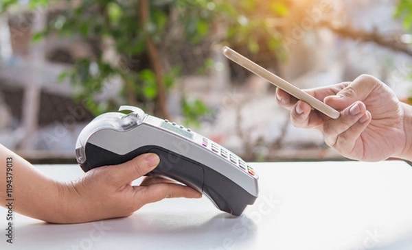 Fototapeta Contactless payment by smartphone. Payment with NFC technology