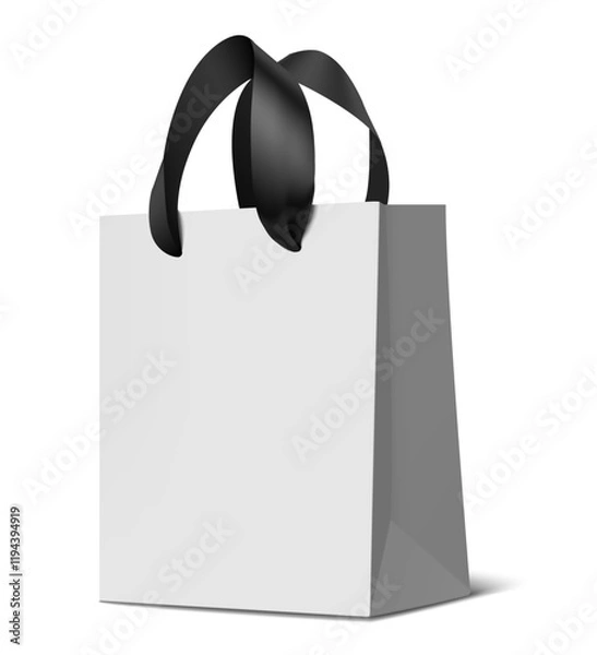 Obraz Decorative realistic ecological white paper bag mockup with black silk ribbon handles for shopping isolated on white with shadow. Vector stock illustration.	