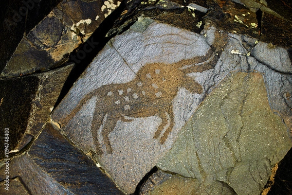 Fototapeta Petroglyphs in Tamgaly. Tamgaly is a petroglyph site in the Almaty region of Kazakhstan. Tamgaly became a UNESCO World Heritage Site in 2004. Tamgaly is located 170 km  northwest of Almaty.