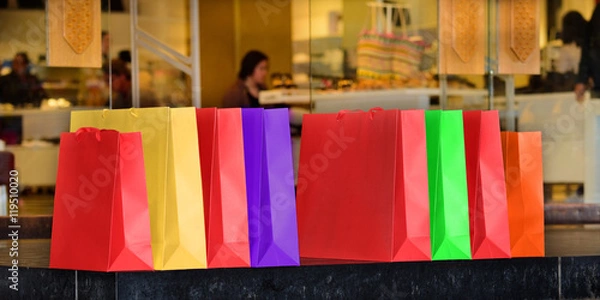 Fototapeta After shopping, bags lined up outside store