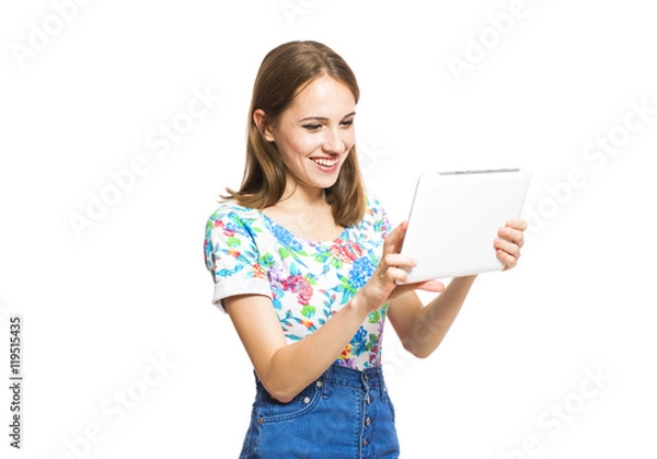 Obraz Funny young girl with a tablet isolated on white background.