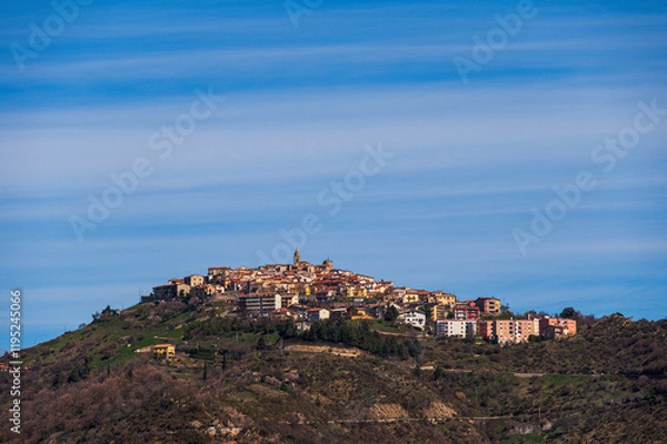Fototapeta top view of the village of Grisolia with a cloudy sky in the background, Cosenza