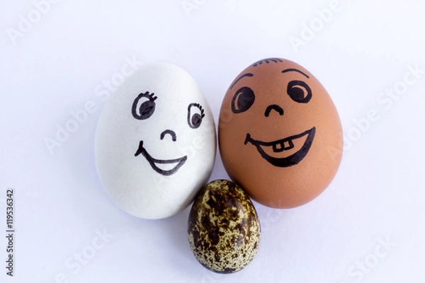 Obraz Funny eggs imitating a happy mixed couple with multicolored baby