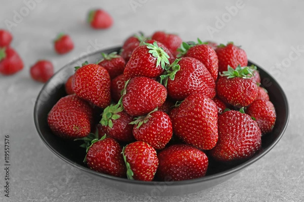 Fototapeta Fresh strawberries in plate on table