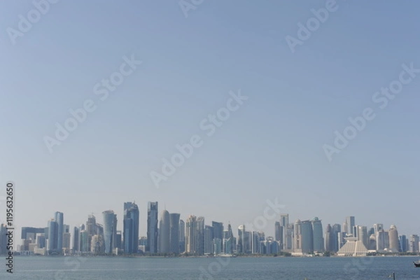 Fototapeta Panoramic view of modern skyscrapers of Doha capital city cityscape on a sunny day in summer, Doha, Qatar