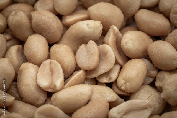 Fototapeta close up of salted peanuts as a background. Toned