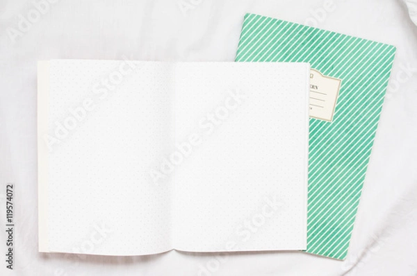 Fototapeta opened blank polka dot notebook