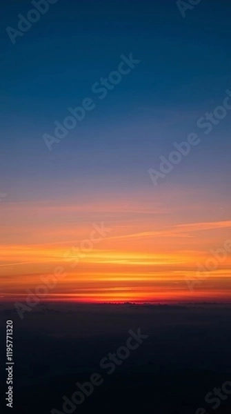 Obraz Vibrant sunset hues paint the evening sky.