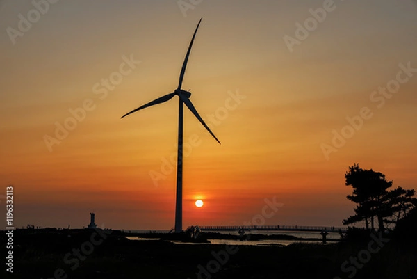 Obraz 해질녘 바다와 하늘 사이로 바람을 받아들이는 풍력발전기 제주 제주시 한경면 신창리 신창풍차해안도로