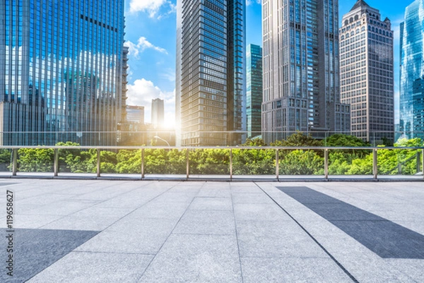 Fototapeta empty brick floor with modern building in background
