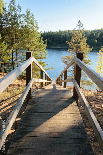 Fototapeta Wooden staircase with railings for descent to the quarry
