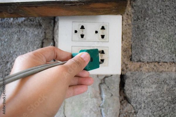 Fototapeta The unplugged socket evokes a sense of stillness and potential energy waiting to be used.