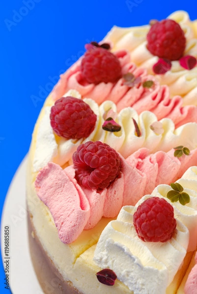 Fototapeta close up Elegant Raspberry-Topped Cheesecake with Dual-Tone Whipped Cream
