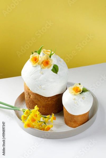 Fototapeta Traditional Ukrainian Paska with Floral Decorations Against a Soft Yellow Background