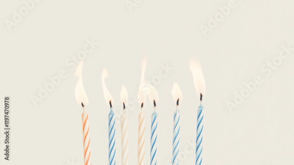 Fototapeta Birthday Candles Glow: Seven pastel-colored birthday candles with flickering flames create a festive and joyful scene, perfect for celebrations and greeting cards.