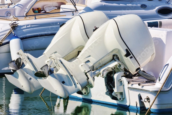Obraz Pair of white outboard engines mounted on white boat