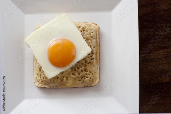 Fototapeta fried egg on a square crumpet