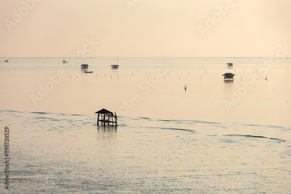 Fototapeta Landscape view of Ao Bang Tabun in the morning, sunrise and this area can rent a boat to see Bryde's whales in Bang Tabun Subdistrict, Phetchaburi Province, Thailand.