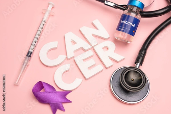 Obraz A vaccine syringe stethoscope and purple ribbon lie near the word CANCER. World cancer day concept background
