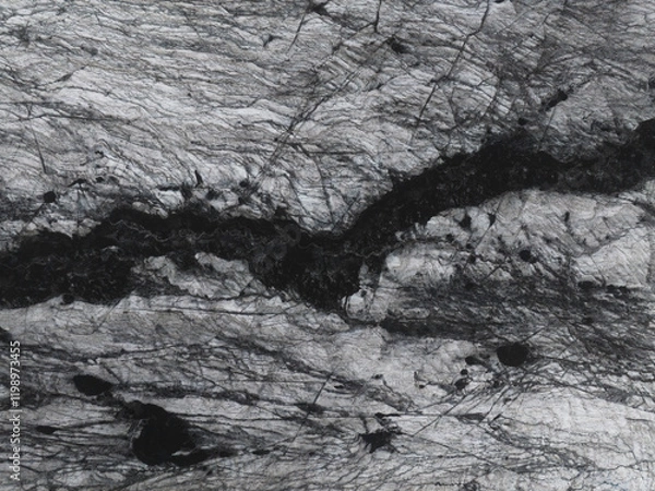 Fototapeta Drone shot looking down on pattern in a glacier