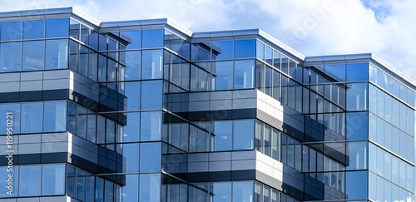 Obraz Linie, szkło i odbicia nowoczesnej architektury. Przeszklony budynek nowej powierzchni biurowej w Moncton, New Brunswick.
Nowe nieruchomości komercyjne w mieście.