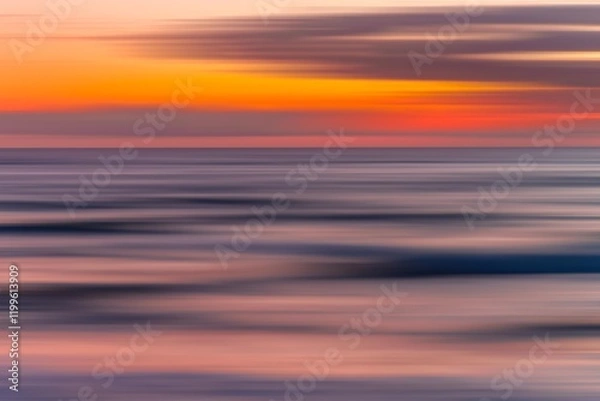 Fototapeta A mesmerizing display of colors unfolds across the sky as shades of orange, purple, and magenta blend seamlessly into the white, creating a vibrant chromatic reverie. 