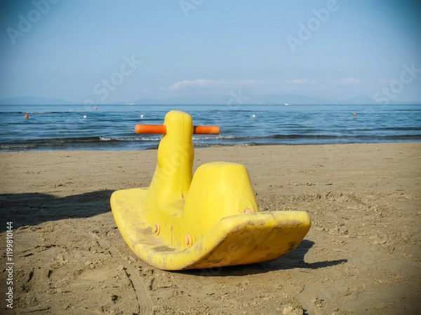 Obraz Yellow plastic duck on a beach 