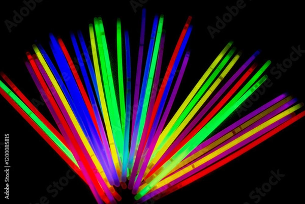 Fototapeta Night party gadget shining with chemical lights in rainbow colors