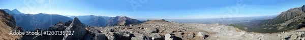 Obraz Panorama of Tatras, Tatra Mountains with rocky hill massif Giewont, Kasprowy Wierch, Kasper Peak, Czerwone Wierchy, Red Peaks, rocky mountain trail and blue sunny sky. Topic: Tatra National Park